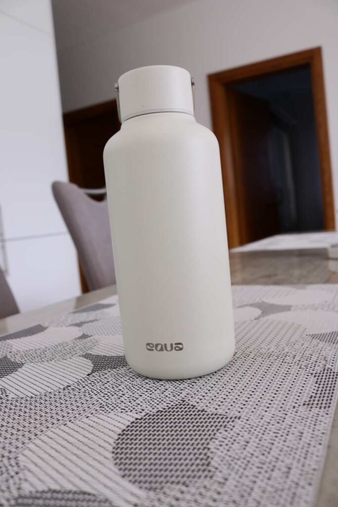 EQUA stainless steel reusable bottle in cream white – premium eco-friendly hydration