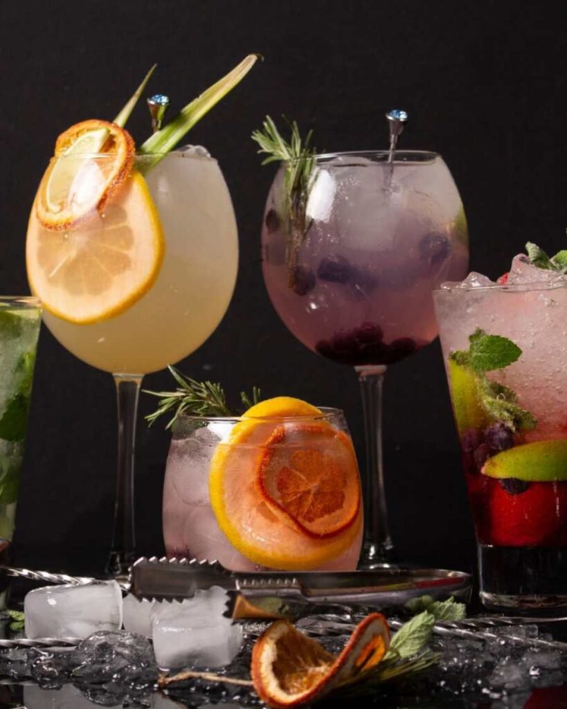 Colorful naturally flavored water with citrus and herbs – healthy hydration alternative