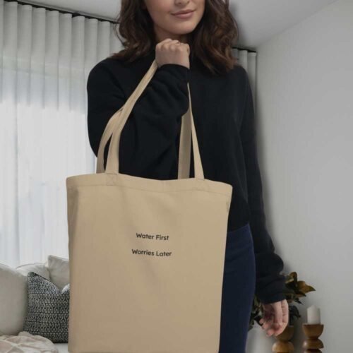 water-first-worries-latter-eco-tote-bag-women-holding